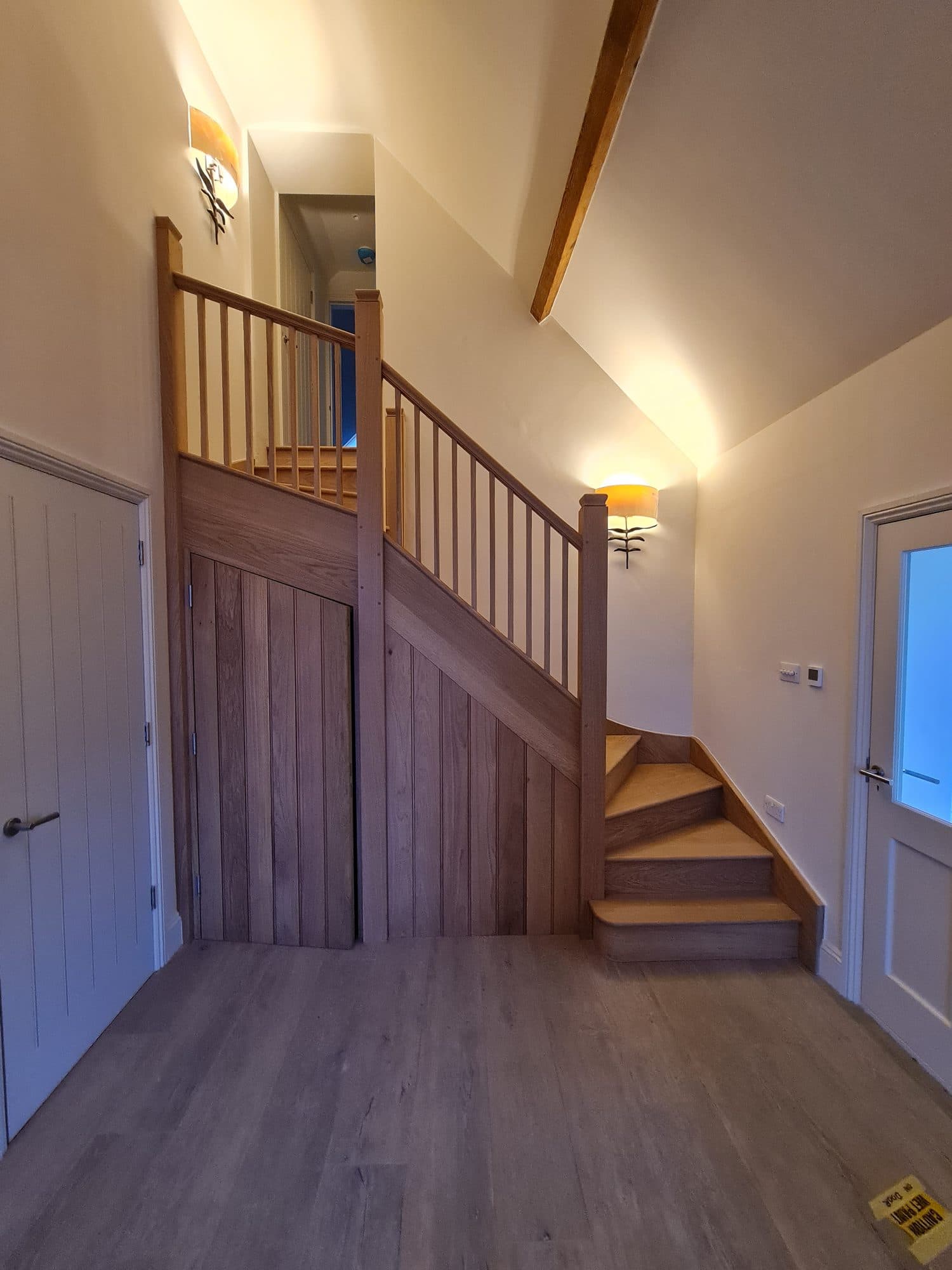 Oak staircase with a boarded spandrel