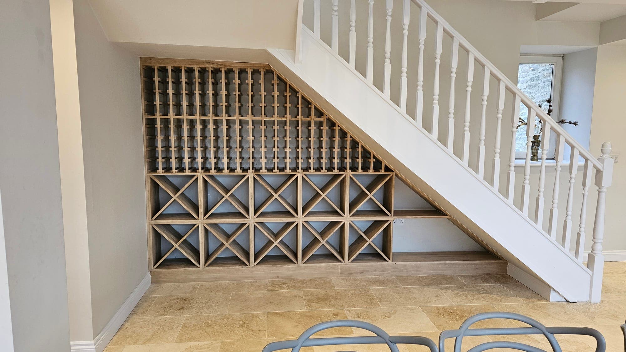 Oak wine store built beneath the stairs