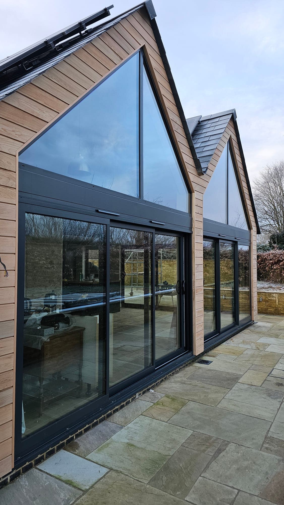 Corner of the glazed gable with oak cladding