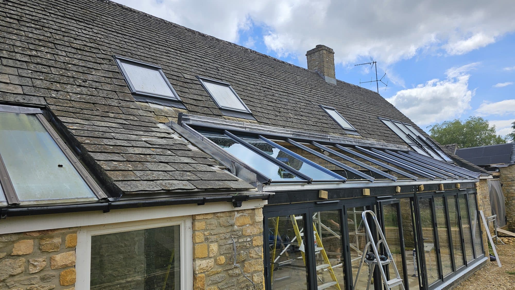 Roof glazing going in along the stone slate roof