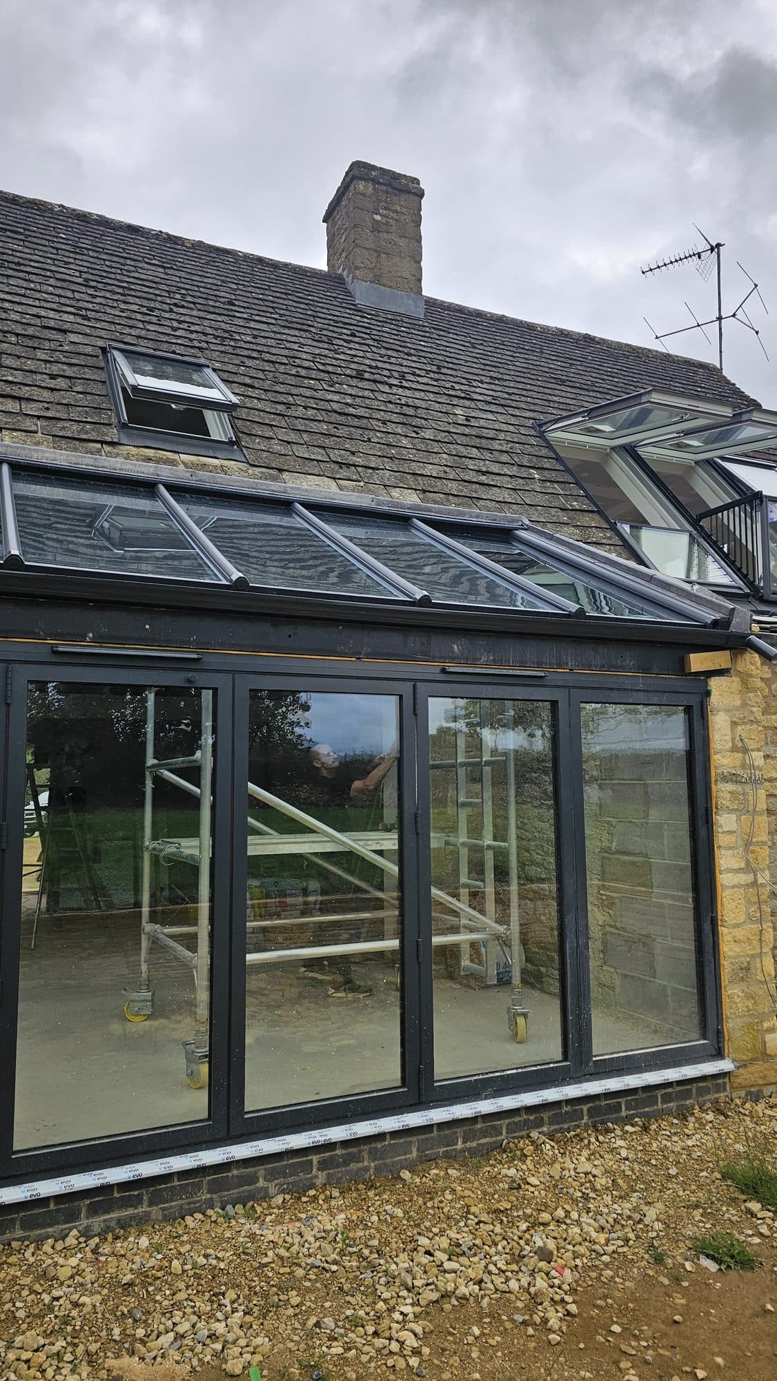 The glazed living space before fit-out, roof glazing above the doors